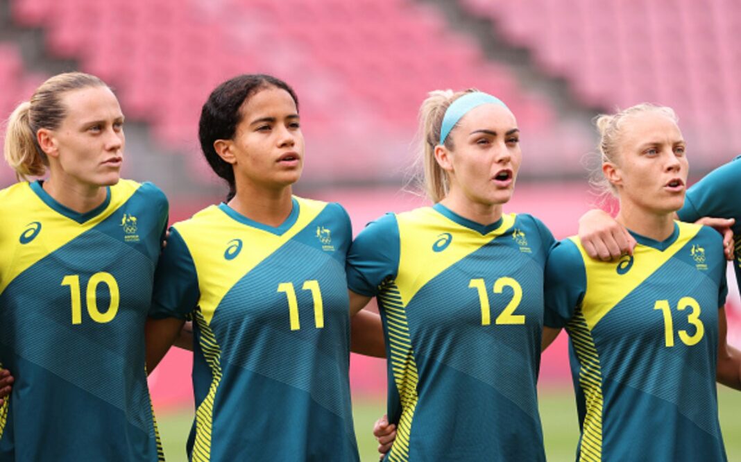 KASHIMA, JAPAN - JULY 27: (L-R) Emily Van Egmond #10, Mary Fowler #11, Ellie Carpenter #12 and Tameka Yallop #13 of Team Australia line up prior the Women's Football Group G match between United States and Australia on day four of the Tokyo 2020 Olympic Games at Kashima Stadium on July 27, 2021 in Kashima, Ibaraki, Japan. (Photo by Atsushi Tomura/Getty Images)