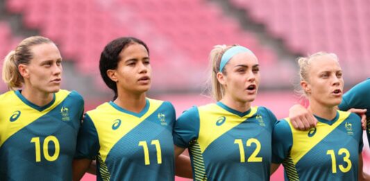 KASHIMA, JAPAN - JULY 27: (L-R) Emily Van Egmond #10, Mary Fowler #11, Ellie Carpenter #12 and Tameka Yallop #13 of Team Australia line up prior the Women's Football Group G match between United States and Australia on day four of the Tokyo 2020 Olympic Games at Kashima Stadium on July 27, 2021 in Kashima, Ibaraki, Japan. (Photo by Atsushi Tomura/Getty Images)