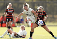 SYDNEY, AUSTRALIA - DECEMBER 11: Holly Caspers of the Wanderers competes with Jenna McCormick of Adelaide during the round four A-League Women's match between Western Sydney Wanderers and Adelaide United at Wanderers Football Park, on December 11, 2022, in Sydney, Australia. (Photo by Brendon Thorne/Getty Images)