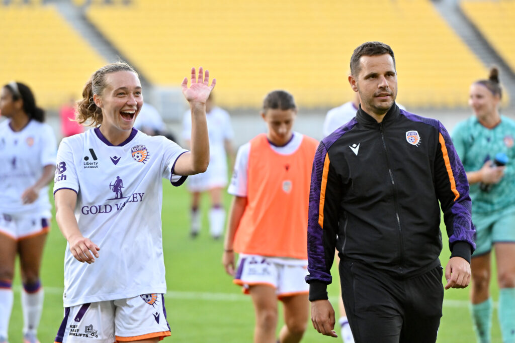 WELLINGTON, NEW ZEALAND - MARCH 18: Elizabeth Anton of Perth Glory and Alex Epakis, coach of the Wellington Phoenix after the round 18 A-League Women's match between Wellington Phoenix and Perth Glory at Sky Stadium, on March 18, 2023, in Wellington, New Zealand. (Photo by Mark Tantrum/Getty Images)