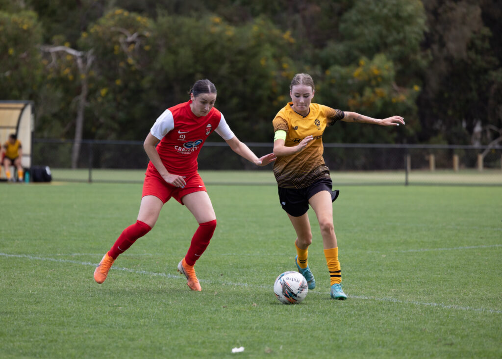 NPLW WA Round 1: Perth RedStar's Sarah Carroll (l) and NTC's Georgia Cassidy in a duel for the ball. Image Credit Perth RedStar/Robbie Anderson