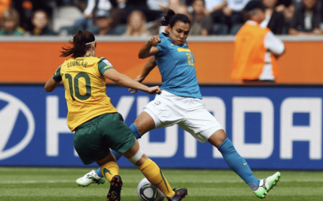 MOENCHENGLADBACH, GERMANY - JUNE 29: Marta (R) of Brazil is challenged by Servet Uzunlar of Australia during the FIFA Women's World Cup 2011 Group D match between Brazil and Australia at the Fifa Womens World Cup Stadium on June 29, 2011 in Moenchengladbach, Germany. (Photo by Alex Grimm/Bongarts/Getty Images)