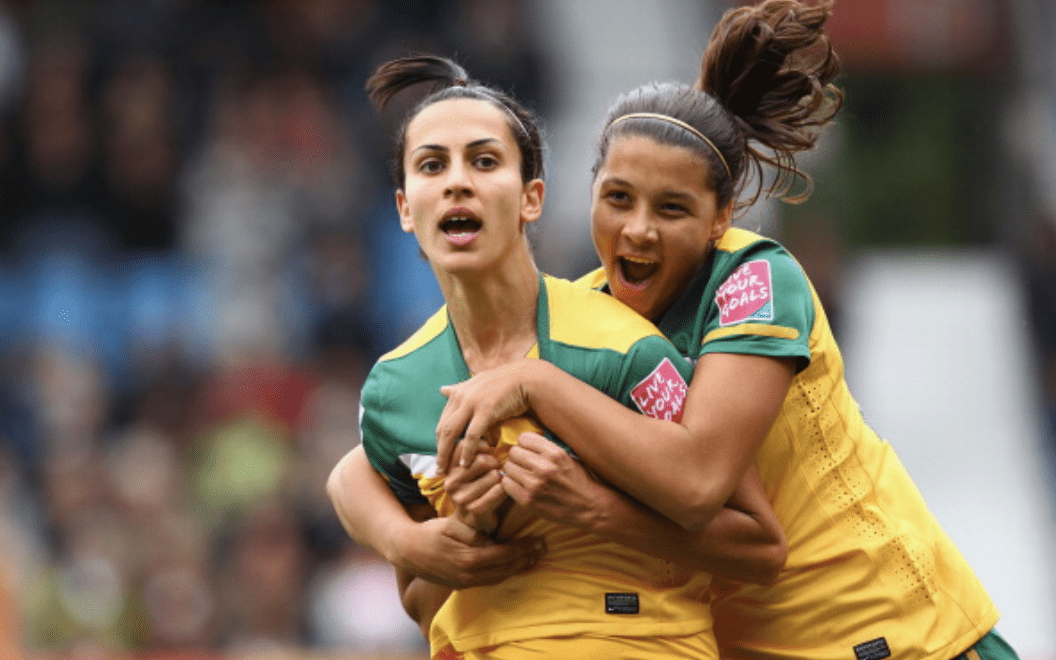 BOCHUM, GERMANY - JULY 03: Leena Khamis #19 of Australia celebrates her goal with teammate Samantha Kerr during the FIFA Women's World Cup 2011 Group D match between Australia and Equatorial Guinea at the FIFA Womens World Cup Stadium Bochum on July 3, 2011 in Bochum, Germany. (Photo by Robert Cianflone - FIFA/FIFA via Getty Images)