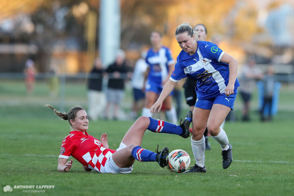 2023 ACT NPL Women's Finals Week 1: Olivia Gurney gets away from Jamie Berkeley. Credit: Anthony Caffery Photography