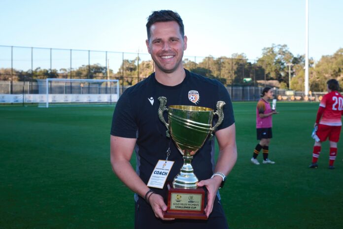 Perth Glory coach Alex Epakis with the Goldfields Challenge Trophy after Glory defeated a WA Select XI in a pre-season friendly.