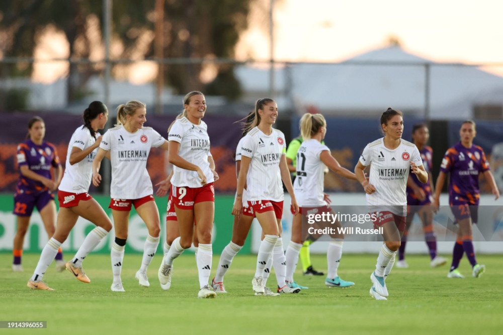PERTH, AUSTRALIA - JANUARY 07: Sophie Harding of the Wanderers celebrates with team mates after scoring a goal during the A-League Women round 11 match between Perth Glory and Western Sydney Wanderers at Macedonia Park, on January 07, 2024, in Perth, Australia. (Photo by Will Russell/Getty Images)