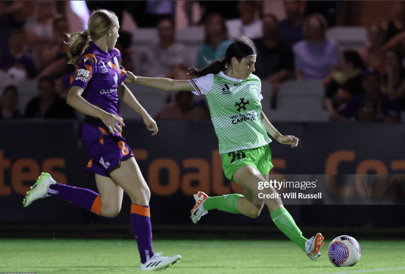 PERTH, AUSTRALIA - FEBRUARY 10: Lillian Skelly of Canberra Utd passes the ball during the A-League Women round 16 match between Perth Glory and Canberra United at Macedonia Park, on February 10, 2024, in Perth, Australia. (Photo by Will Russell/Getty Images)