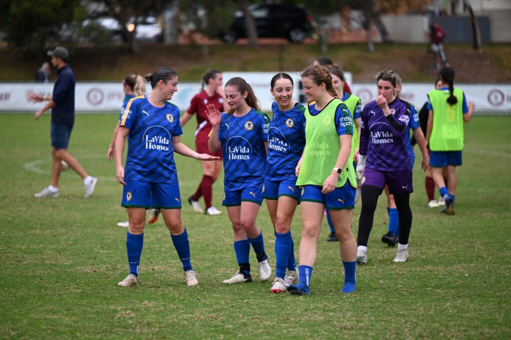 UWA Nedlands players celebrate their first ever win in the NPLW. Image credit One Touch Sports Photography