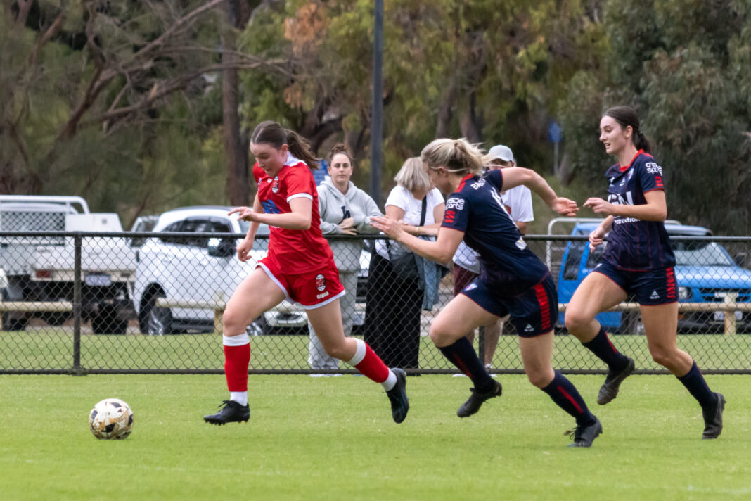 Perth RedStar's Olivia Wood (l) in action against Balcatta Etna earlier this season. Image credit Neil Bennett