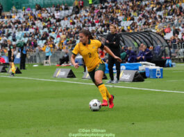 The Lost Aussie: Former Matildas defender Angie Beard runs with the ball during a game between the Matildas and USA, played at Stadium Australia on November 27, 2021. Photo credit: Dan Ullman (Instagram - @aptitudephotography )