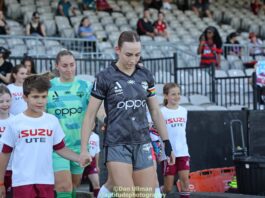 Wellington Phoenix defender Mackenzie Barry leads her team out ahead of their 2024-25 Unite Round game against Adelaide United at Netstrata Jubilee Stadium. Photo credit: Dan Ullman (Instagram - @aptitudephotgraphy )