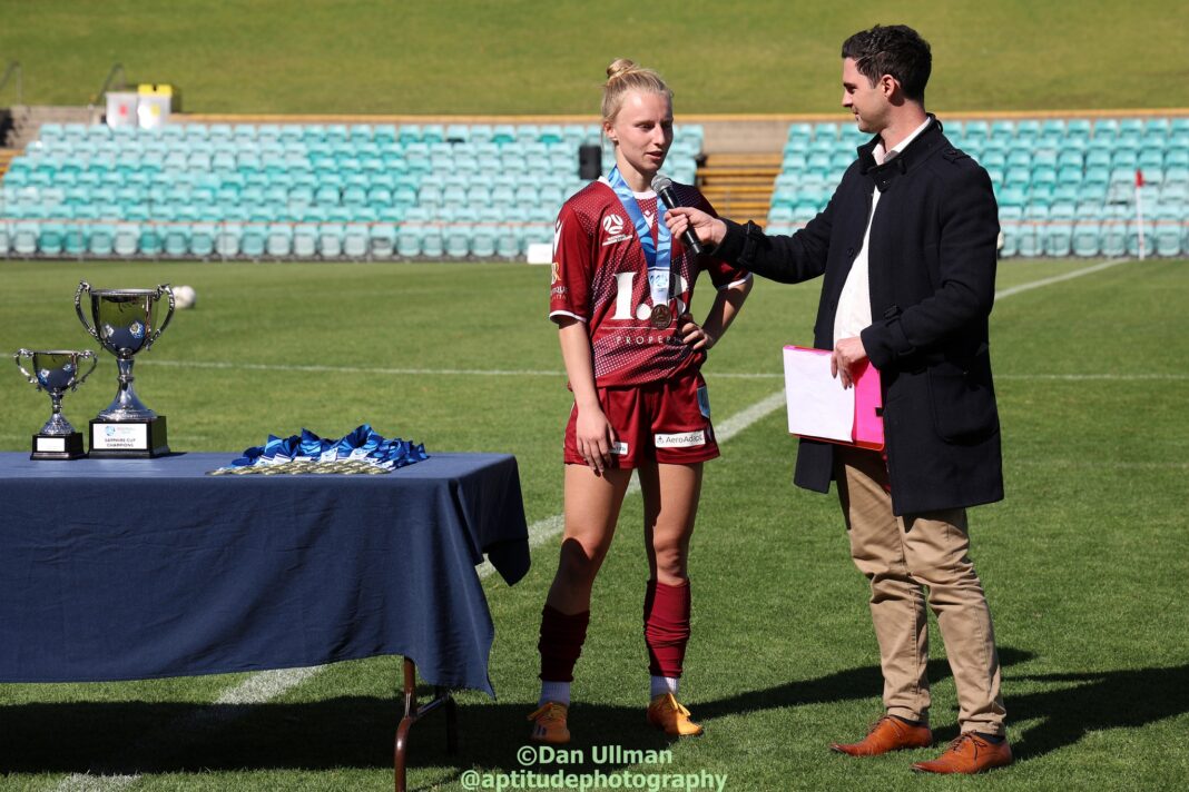 Holly McNamara (then of APIA Leichhardt) speaks with Football NSW media personality James Preston, after being named Player of the Match in the 2023 Sapphire Cup Final, contested by APIA and Northern Tigers at Leichhardt Oval. Photo credit: Dan Ullman (Instagram - @aptitudephotography )