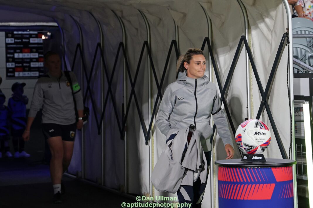 Central Coast Mariners head coach Emily Husband walks out of the tunnel before the A-League Women game between the Mariners and Melbourne Victory, at Central Coast Stadium on 11 April 2025. Photo credit: Dan Ullman (Instagram - @aptitudephotography )