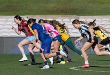 PODCAST | Capital Gains The half-time race at the 2025 NPL Women's NSW Grand Final, which was won by Sienna Dale (blue uniform). Photo credit: Football NSW