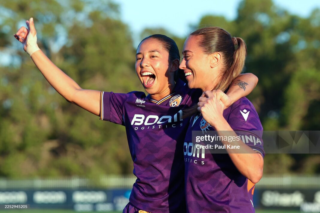 PERTH, AUSTRALIA - DECEMBER 21: Emma Tovar and Isobel Dalton of the Glory celebrate winning the round eight A-League Women match between Perth Glory and Adelaide United at Sam Kerr Football Centre, on December 21, 2025, in Perth, Australia. (Photo by Paul Kane/Getty Images)